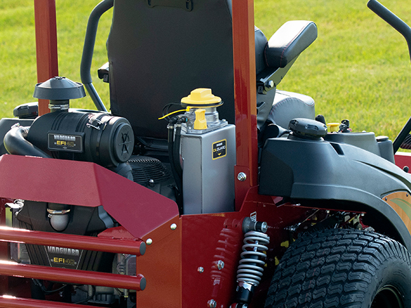 Man riding stand on commercial mower