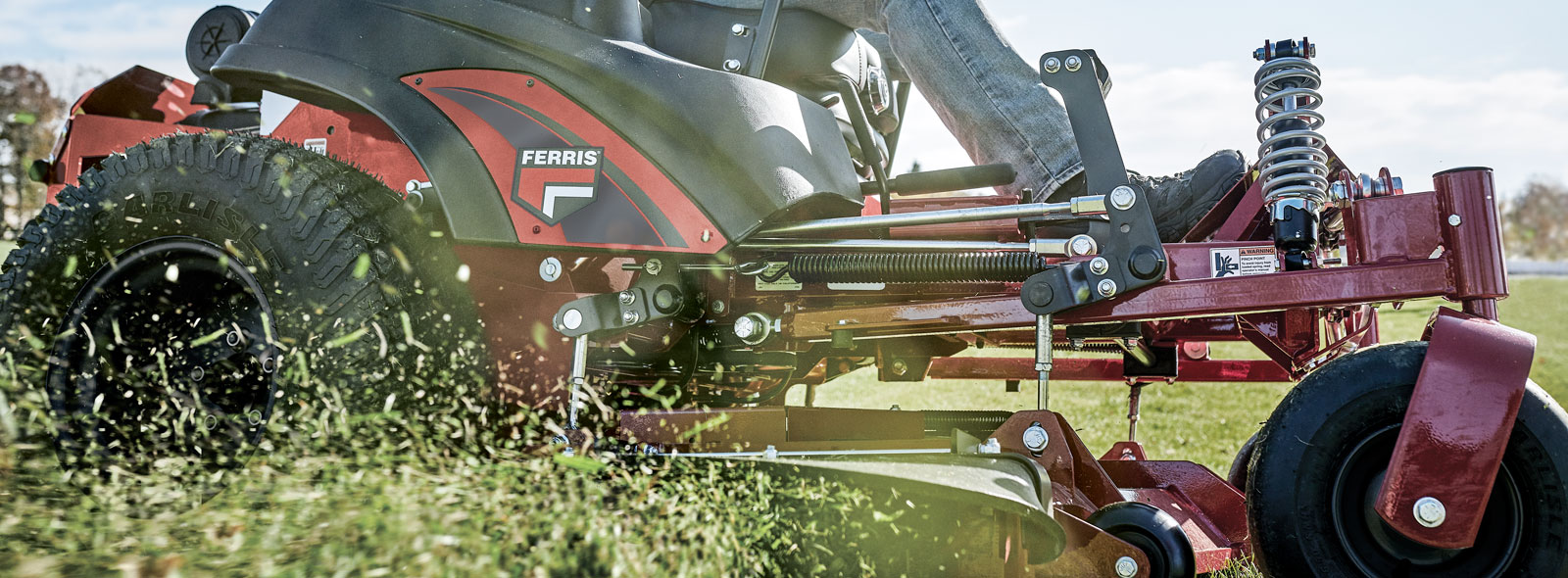 Man riding Ferris zero turn lawn mower