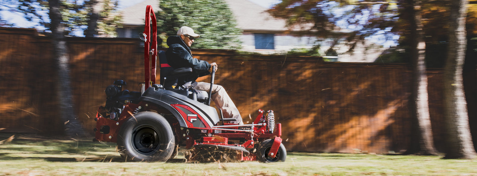 Man riding zero turn mower 