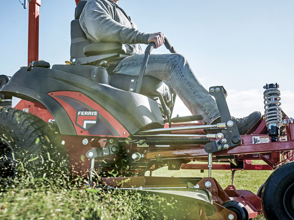 Man riding Ferris zero turn lawn mower