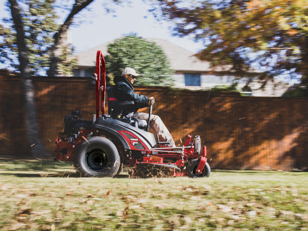 Man riding zero turn mower 