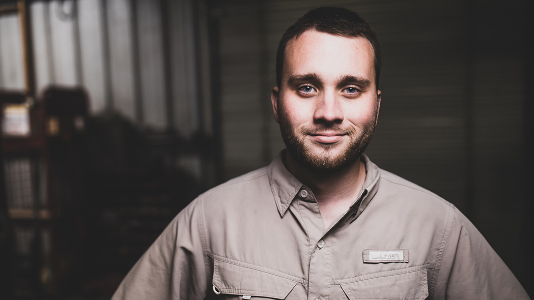 Man looking at camera with a subtle smile