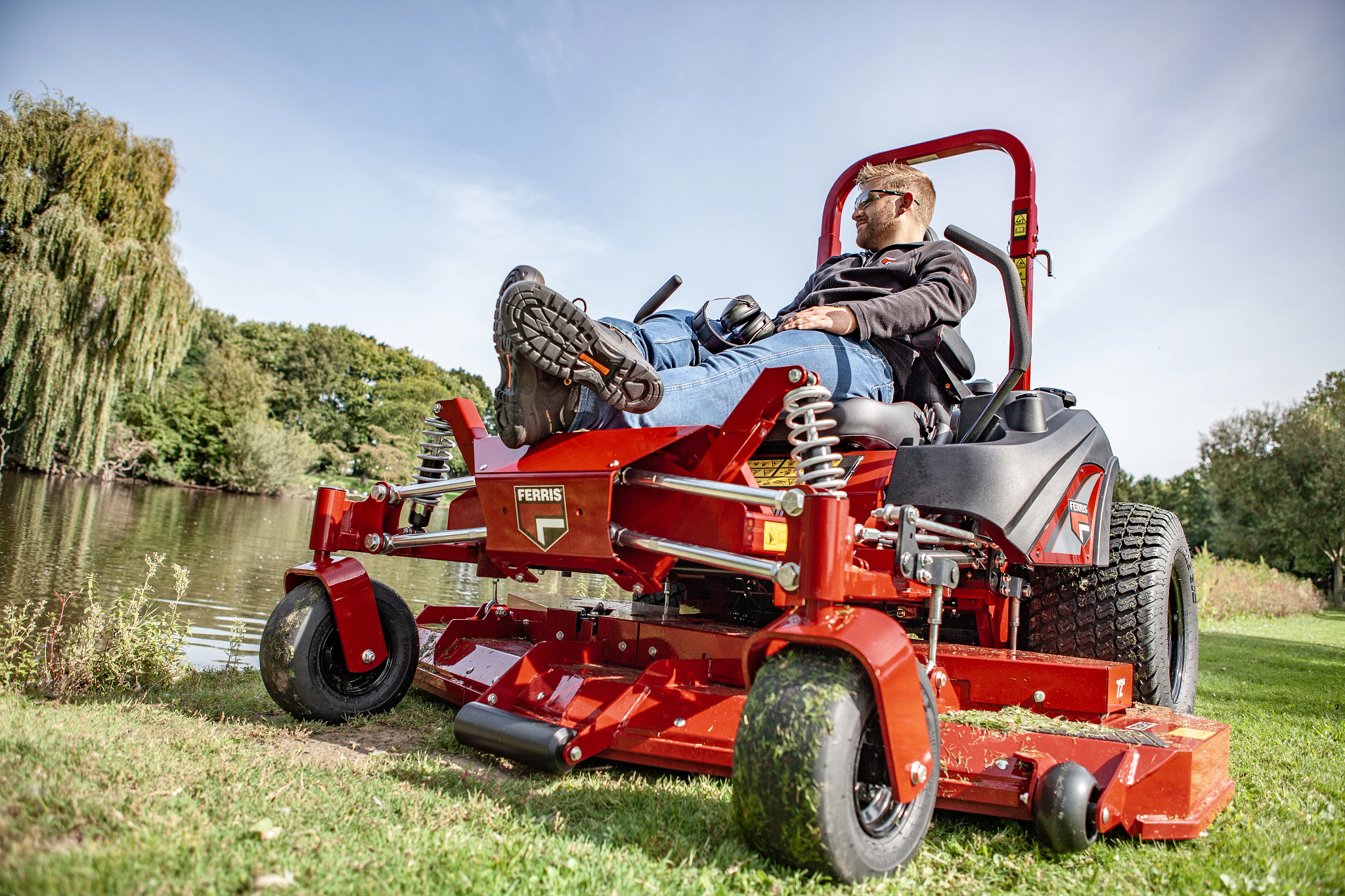 Man relaxing on Ferris zero turn mower